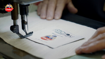 Findus cucire uno stemma